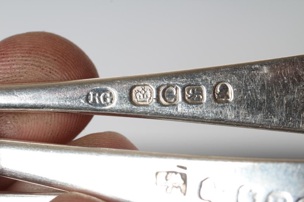 A MATCHED AND COMPOSITE GEORGE III SILVER TABLE SERVICE Image