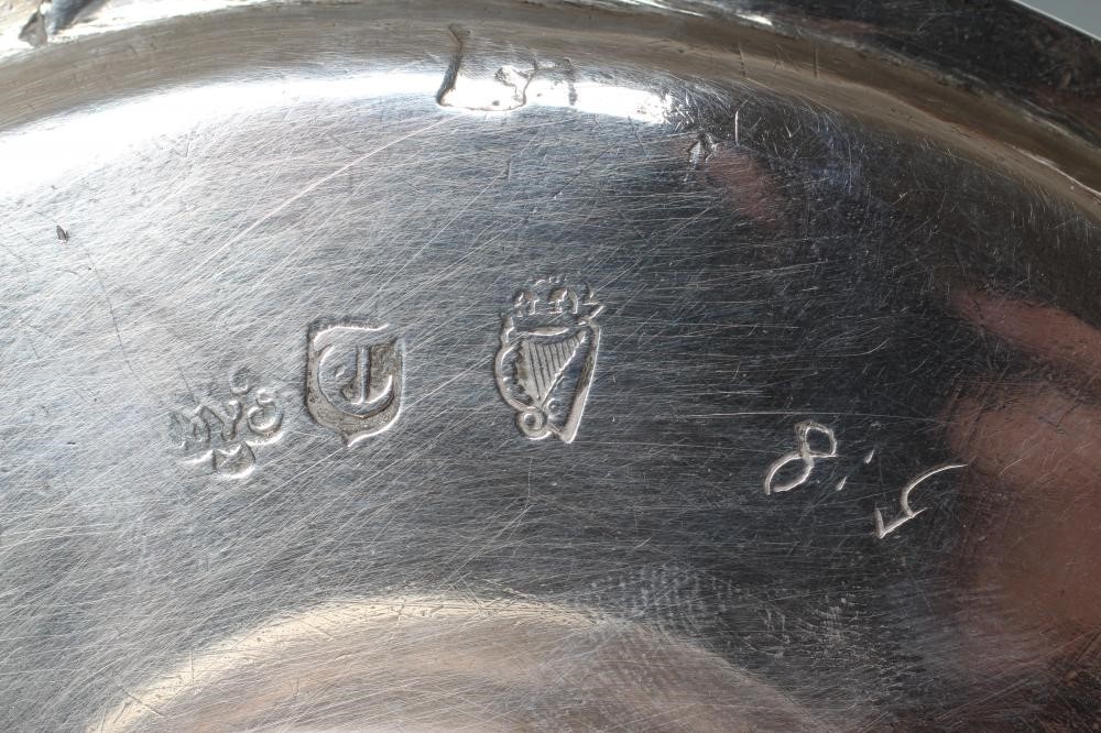 A QUEEN ANNE IRISH SILVER FOOTED WAITER Image