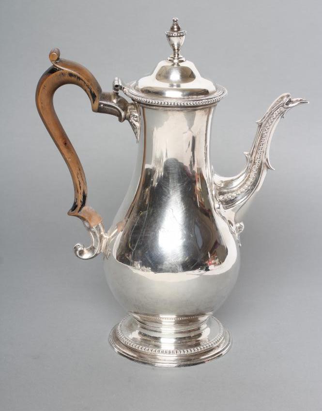 A GEORGE III SILVER COFFEE POT Image