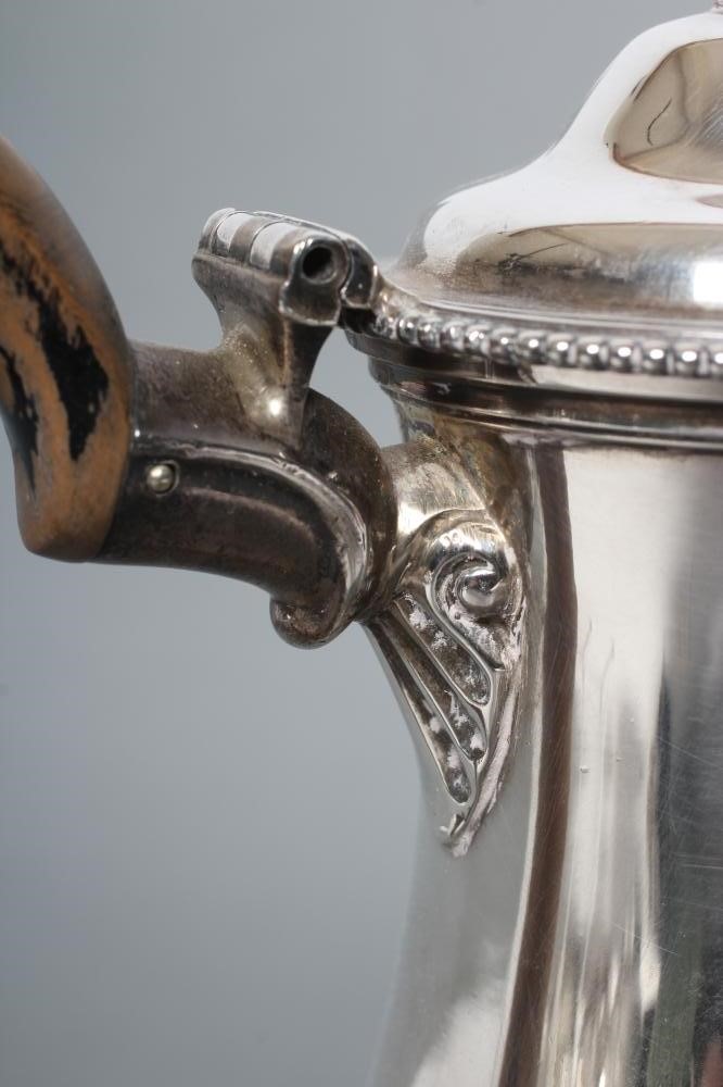 A GEORGE III SILVER COFFEE POT Image