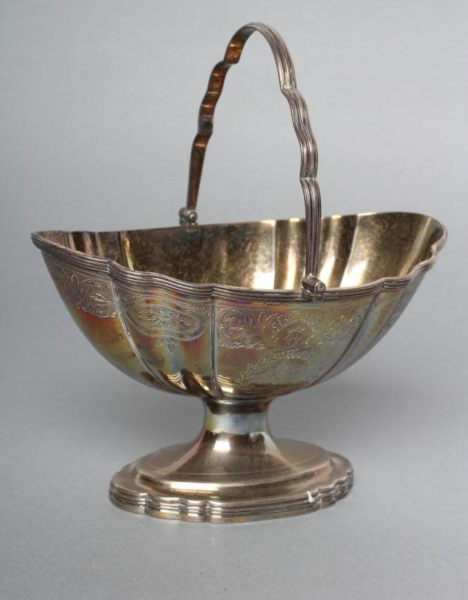 A GEORGE III SILVER SUGAR BASKET Image