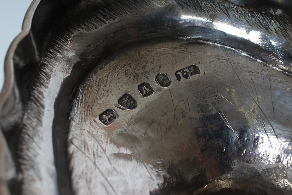 A GEORGE III SILVER SUGAR BASKET Image