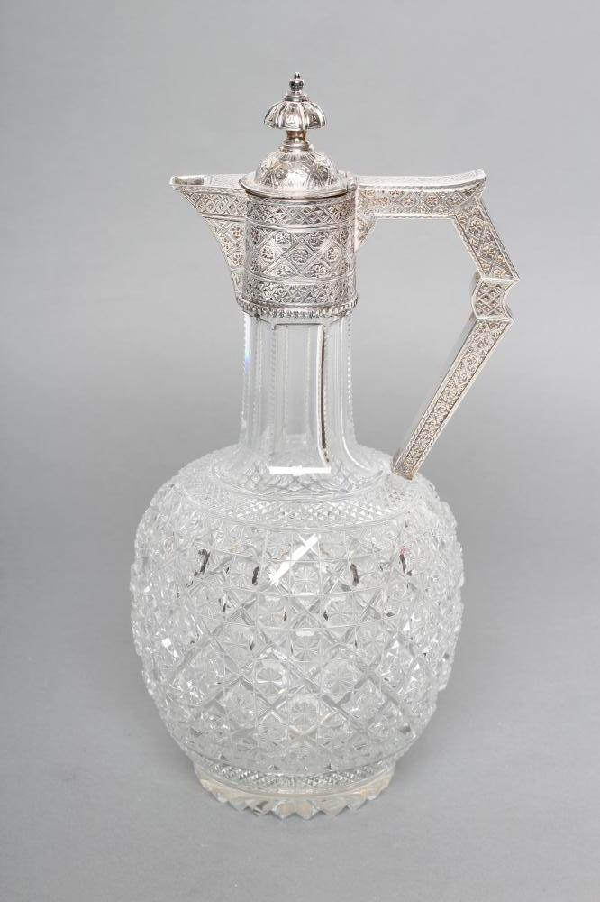 A LATE VICTORIAN SILVER MOUNTED SHAFT AND GLOBE GLASS CLARET JUG Image