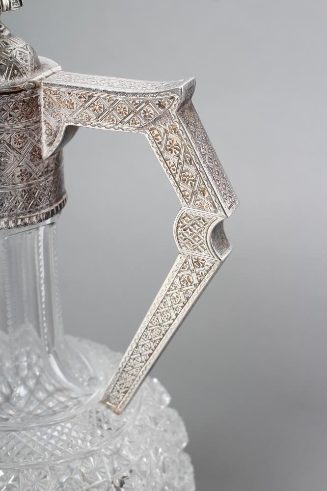 A LATE VICTORIAN SILVER MOUNTED SHAFT AND GLOBE GLASS CLARET JUG Image