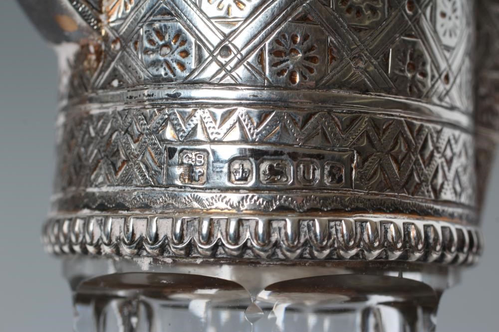 A LATE VICTORIAN SILVER MOUNTED SHAFT AND GLOBE GLASS CLARET JUG Image