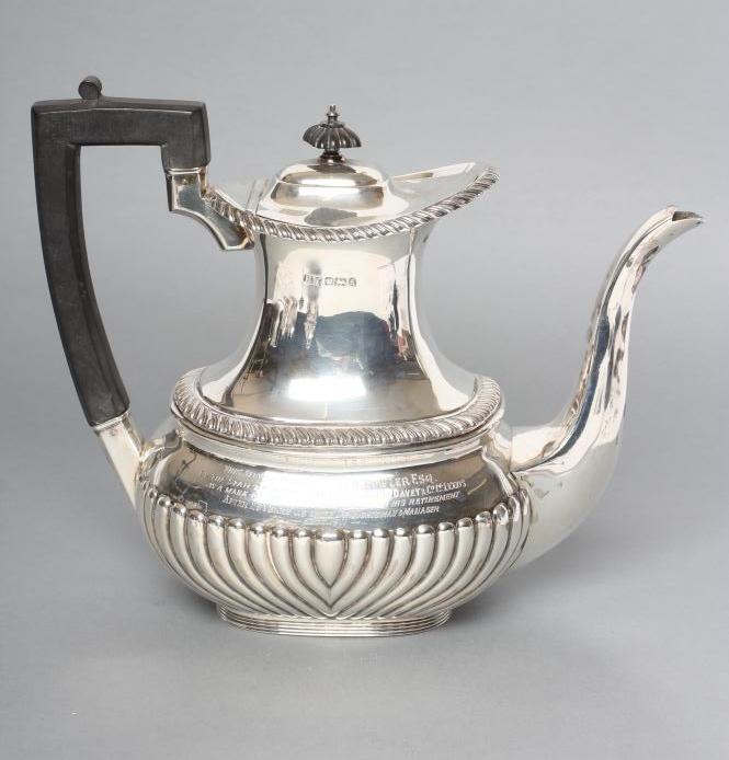 AN EDWARDIAN SILVER HOT WATER JUG Image