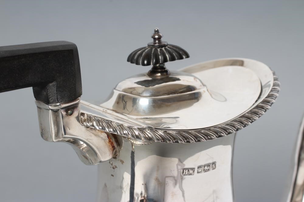 AN EDWARDIAN SILVER HOT WATER JUG Image