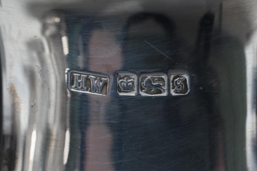 AN EDWARDIAN SILVER HOT WATER JUG Image
