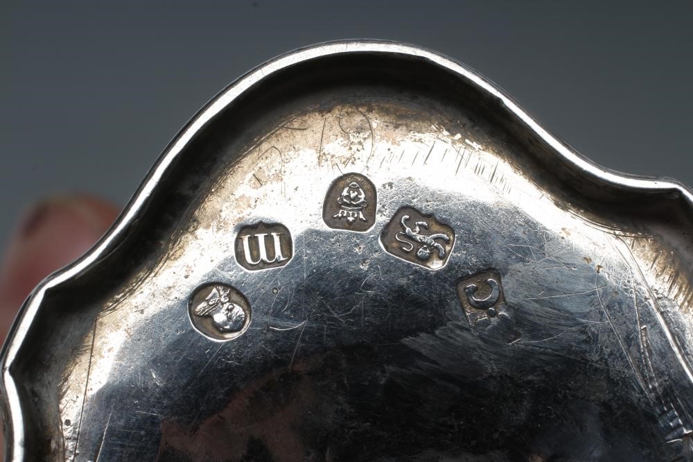 A GEORGE III SILVER SUGAR BASKET AND MATCHING CREAM BASKET Image