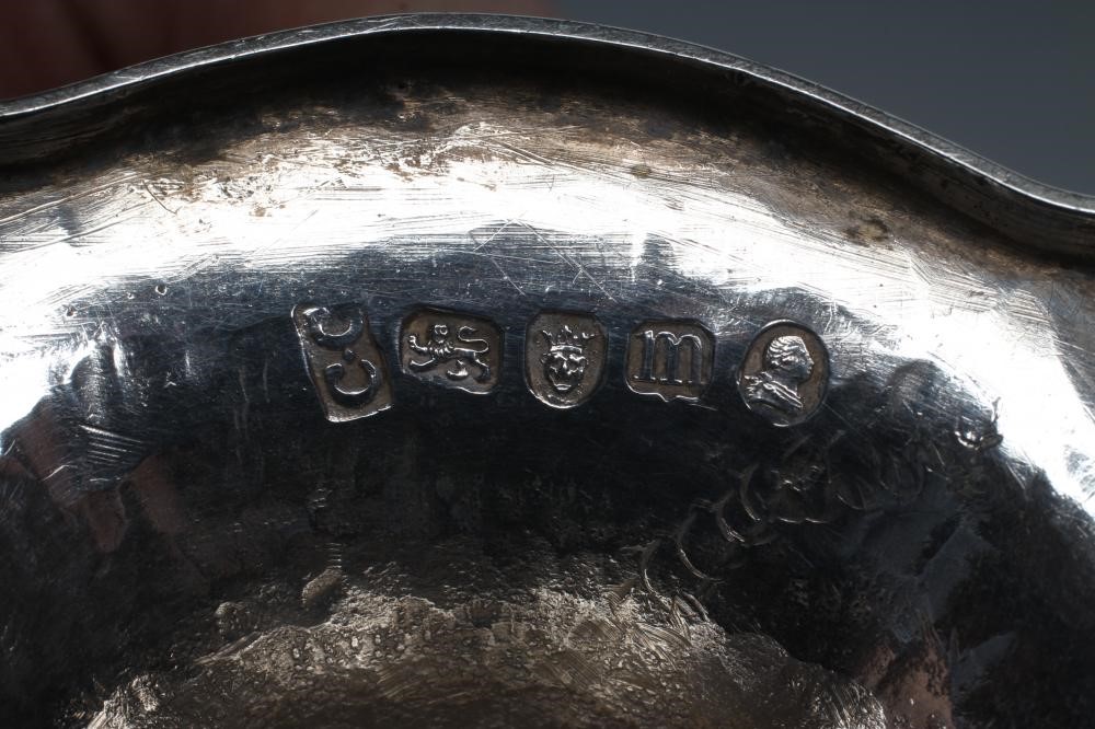 A GEORGE III SILVER SUGAR BASKET AND MATCHING CREAM BASKET Image