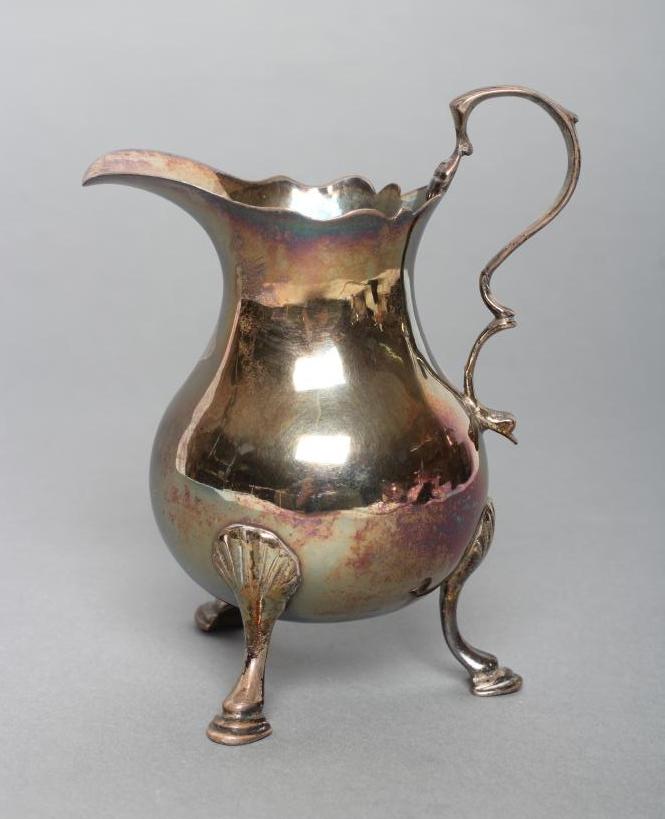A GEORGE II SILVER CREAM JUG Image