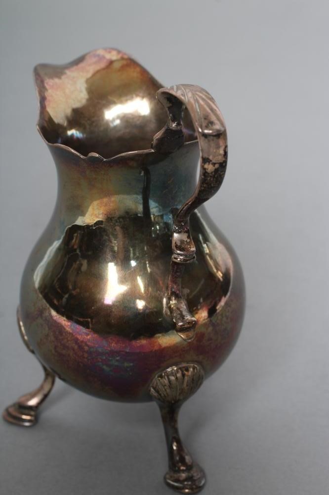 A GEORGE II SILVER CREAM JUG Image