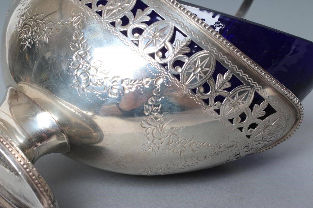 A GEORGE III SILVER SUGAR BASKET Image