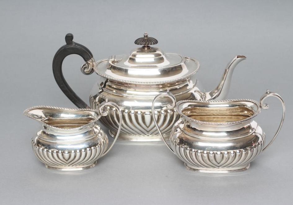 A BACHELOR'S LATE VICTORIAN SILVER THREE PIECE TEA SERVICE Image