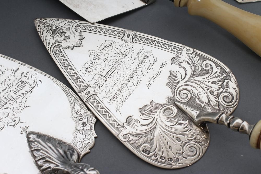 A COLLECTION OF FOUR VICTORIAN SILVER PRESENTATION TROWELS Image