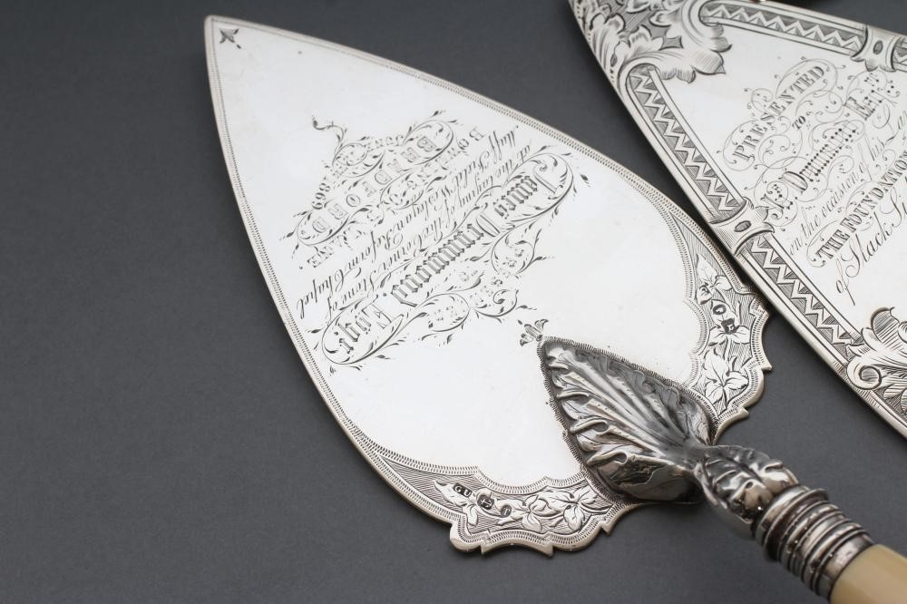 A COLLECTION OF FOUR VICTORIAN SILVER PRESENTATION TROWELS Image