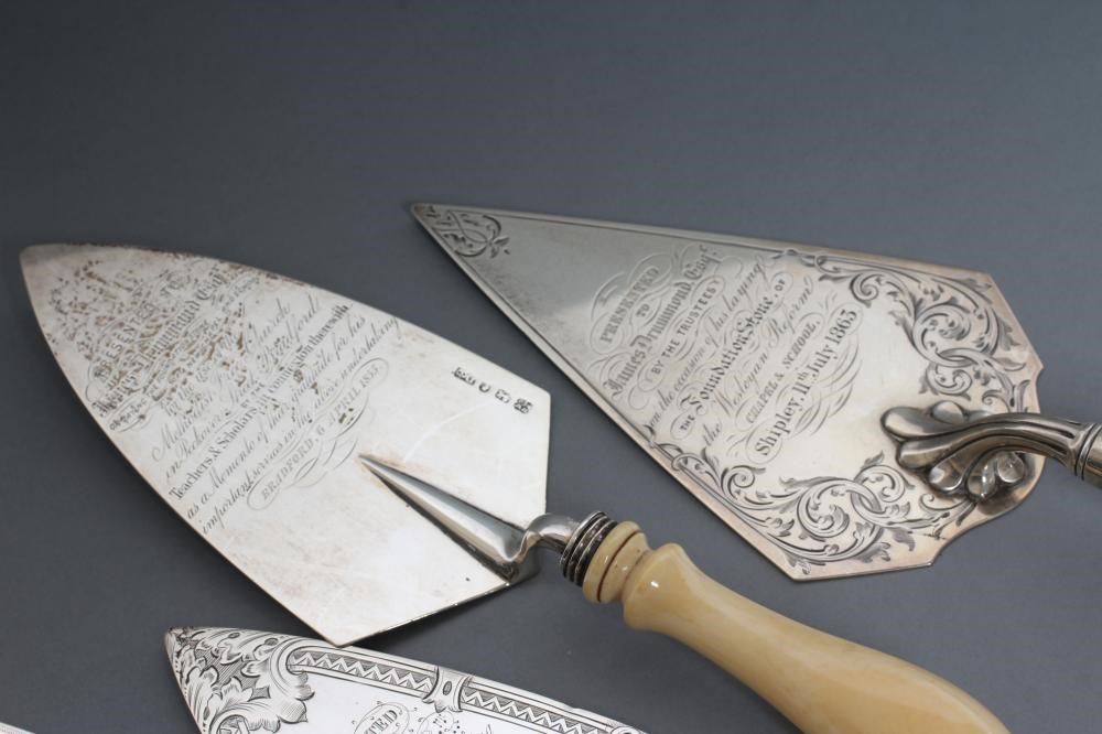 A COLLECTION OF FOUR VICTORIAN SILVER PRESENTATION TROWELS Image