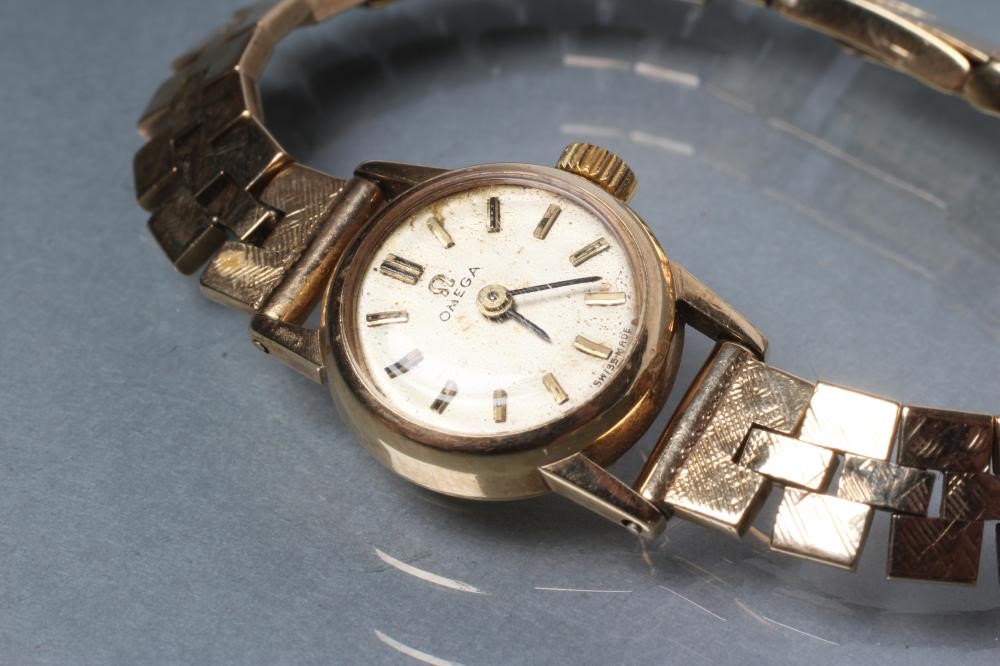 A LADY'S 9CT GOLD OMEGA WRISTWATCH Image