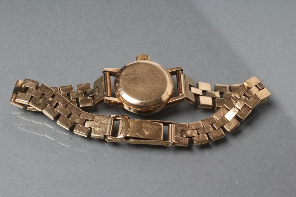 A LADY'S 9CT GOLD OMEGA WRISTWATCH Image