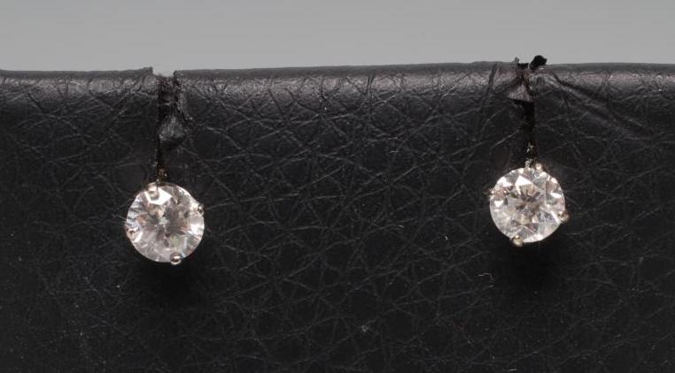 A PAIR OF SOLITAIRE DIAMOND EAR STUDS Image