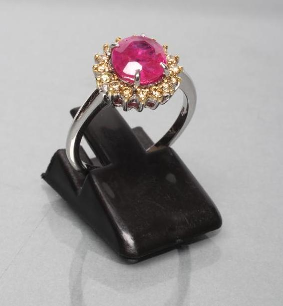A RUBY AND DIAMOND CLUSTER RING Image