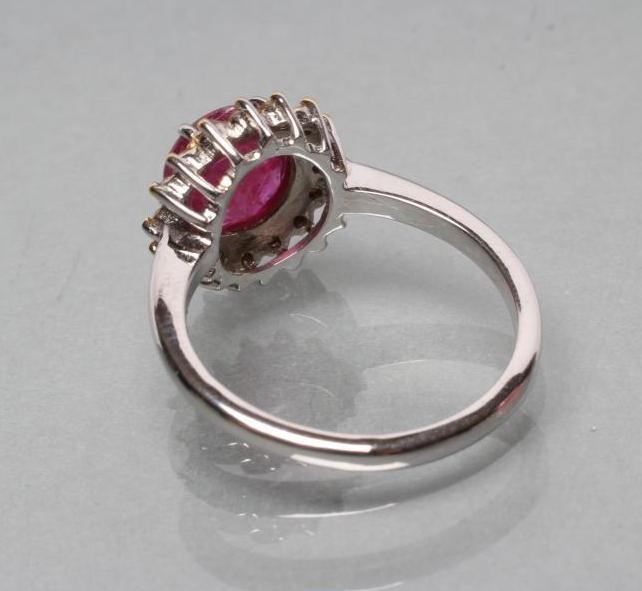 A RUBY AND DIAMOND CLUSTER RING Image