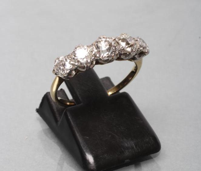 A FIVE STONE DIAMOND RING Image