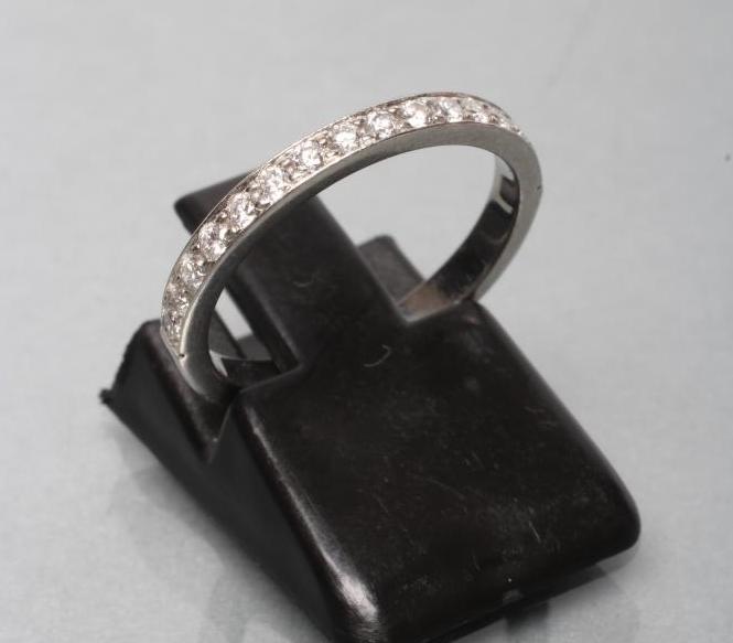 A DIAMOND HALF HOOP ETERNITY RING Image