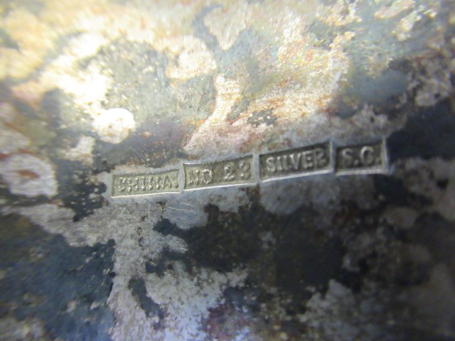 A CHINESE SILVER STIFF HINGED BANGLE Image