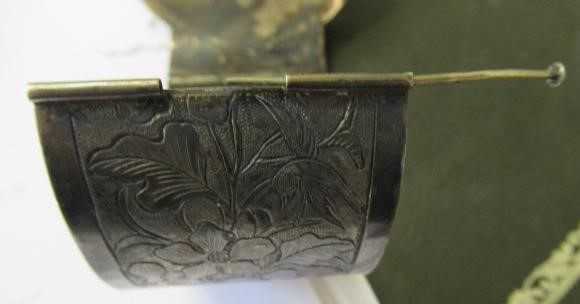 A CHINESE SILVER STIFF HINGED BANGLE Image