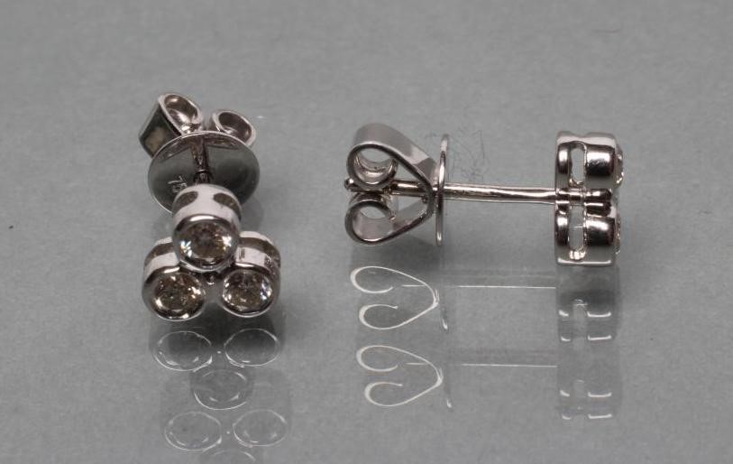 A PAIR OF DIAMOND EAR STUDS Image
