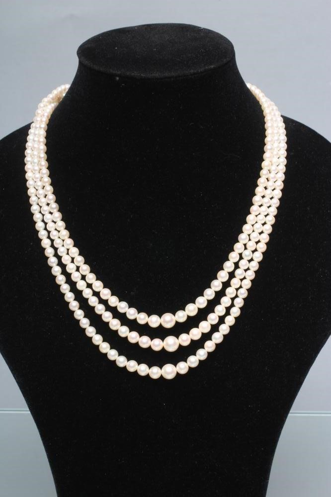 A TRIPLE STRAND CULTURED PEARL NECKLACE Image