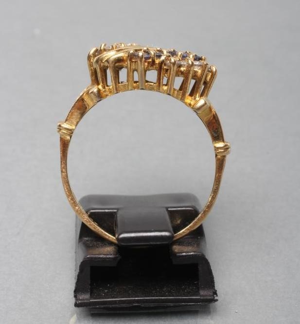 A DRESS RING claw set with nine small sapphires and nine small round brilliant cut diamonds Image