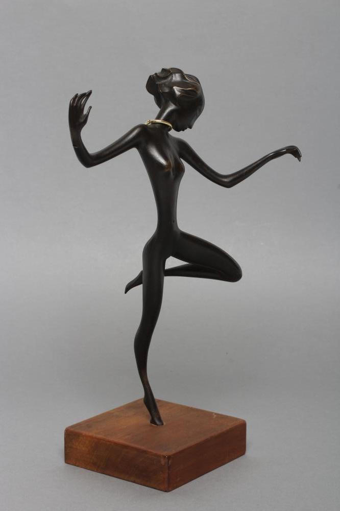 A HAGENAUER(?) BRONZE FIGURE OF A YOUNG AFRICAN FEMALE DANCER with gilded neck ring Image