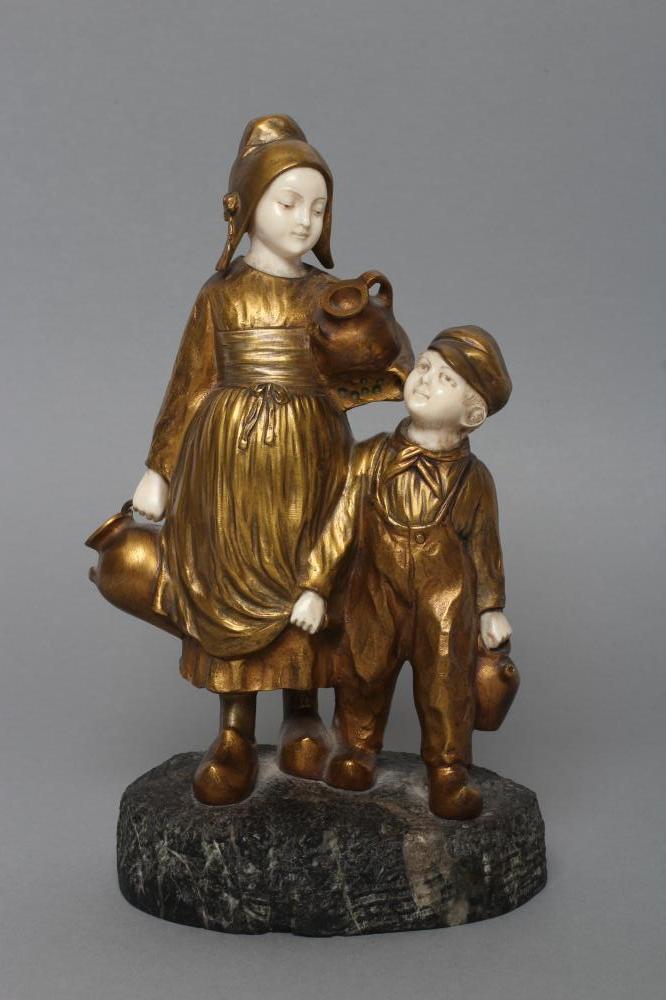 AFTER JOSEPH D'ASTE (Italian 1881- 1945) an Art Deco bronze figure group cast as two young Dutch Image