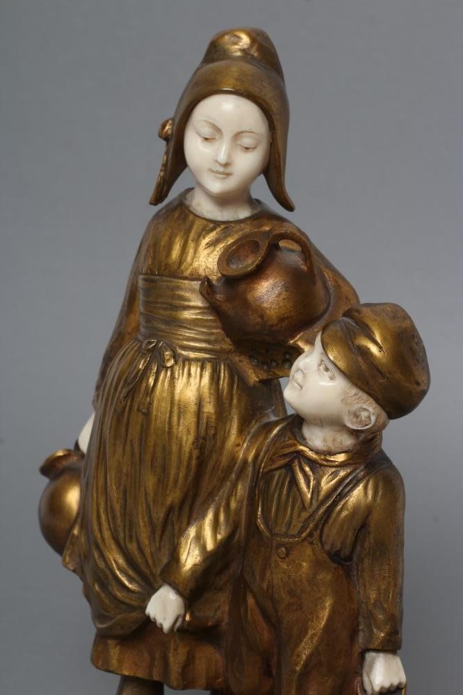 AFTER JOSEPH D'ASTE (Italian 1881- 1945) an Art Deco bronze figure group cast as two young Dutch Image