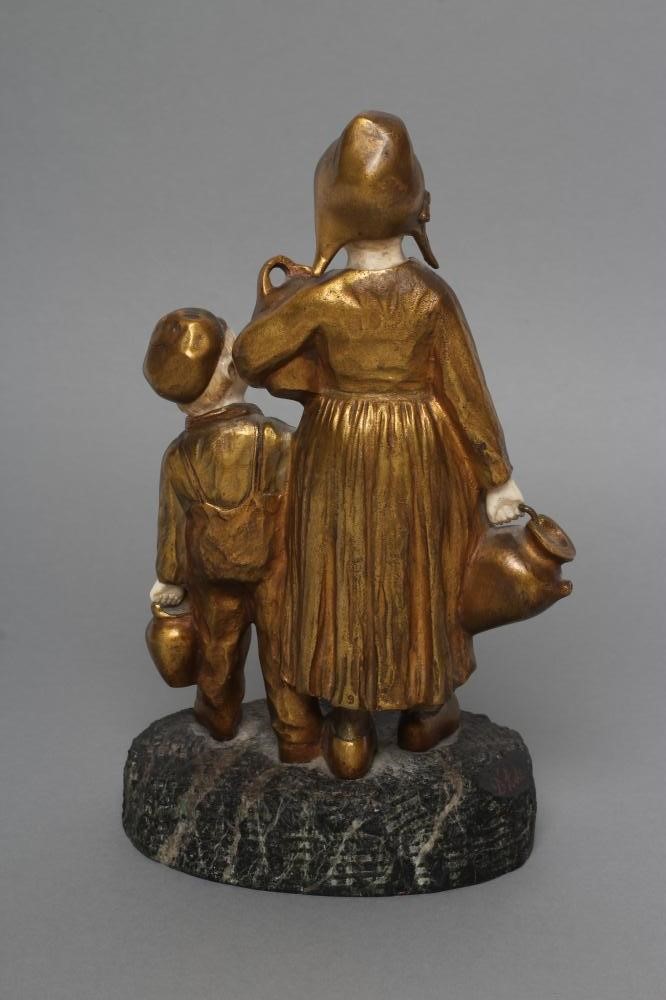 AFTER JOSEPH D'ASTE (Italian 1881- 1945) an Art Deco bronze figure group cast as two young Dutch Image