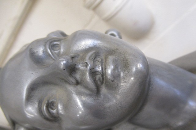 AFTER LORENZL - a large silvered metal figural lamp base modelled as a young female nude standing on Image