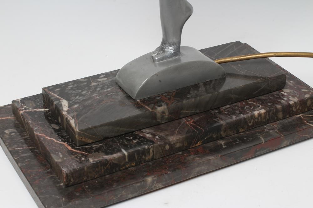 AFTER LORENZL - a large silvered metal figural lamp base modelled as a young female nude standing on Image