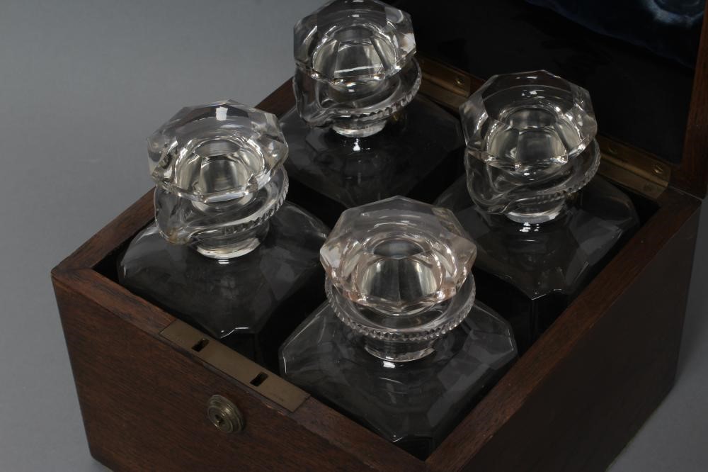 A LATE VICTORIAN OAK FOUR BOTTLE DECANTER BOX of square section with Bramah lock Image