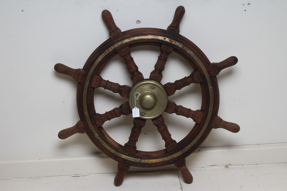 A BRASS AND MAHOGANY EIGHT SPOKE SHIP'S WHEEL Image
