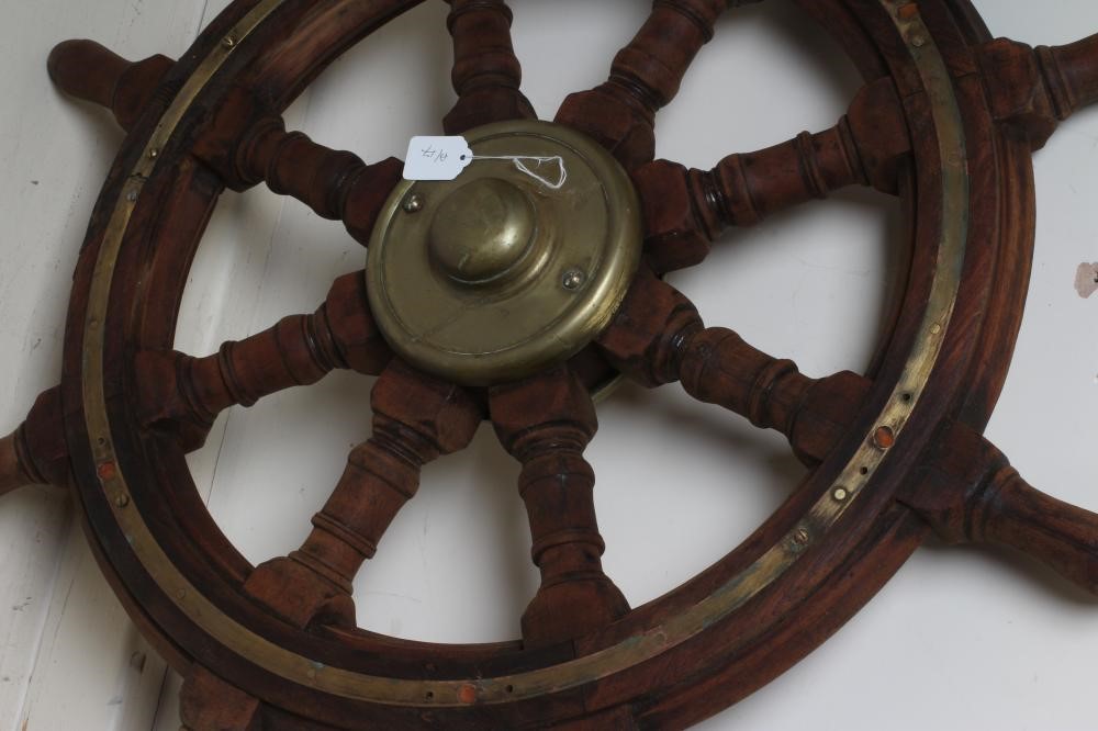 A BRASS AND MAHOGANY EIGHT SPOKE SHIP'S WHEEL Image