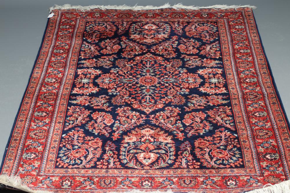 A PERSIAN WOOL RUG Image