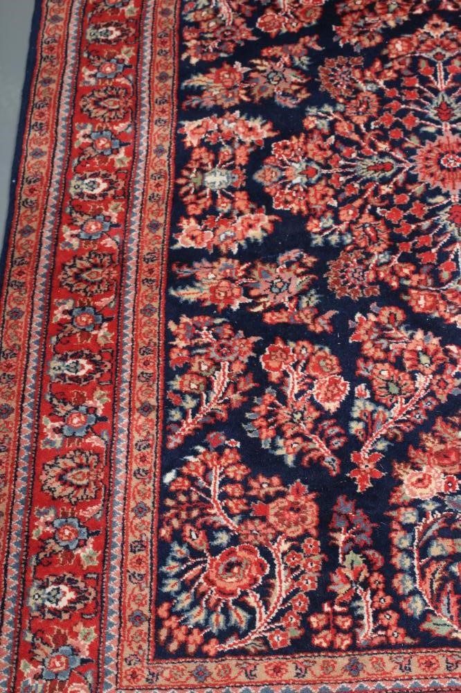A PERSIAN WOOL RUG Image