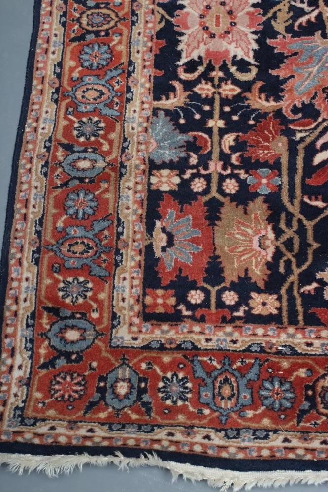 A PERSIAN WOOL RUG Image