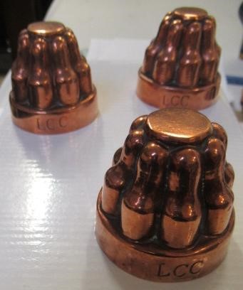 FIFTEEN SMALL VICTORIAN COPPER JELLY MOULDS including a shell Image