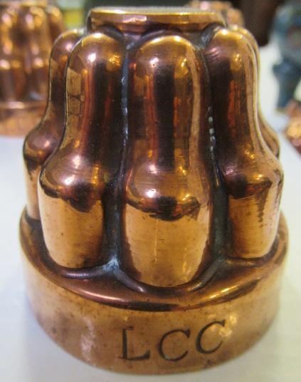 FIFTEEN SMALL VICTORIAN COPPER JELLY MOULDS including a shell Image