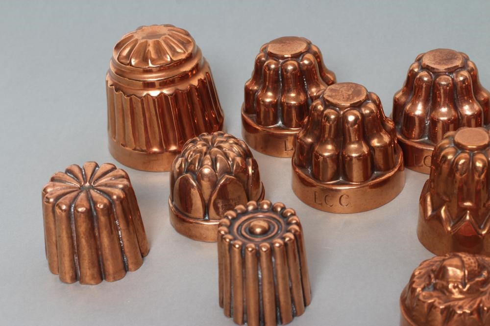 FIFTEEN SMALL VICTORIAN COPPER JELLY MOULDS including a shell Image