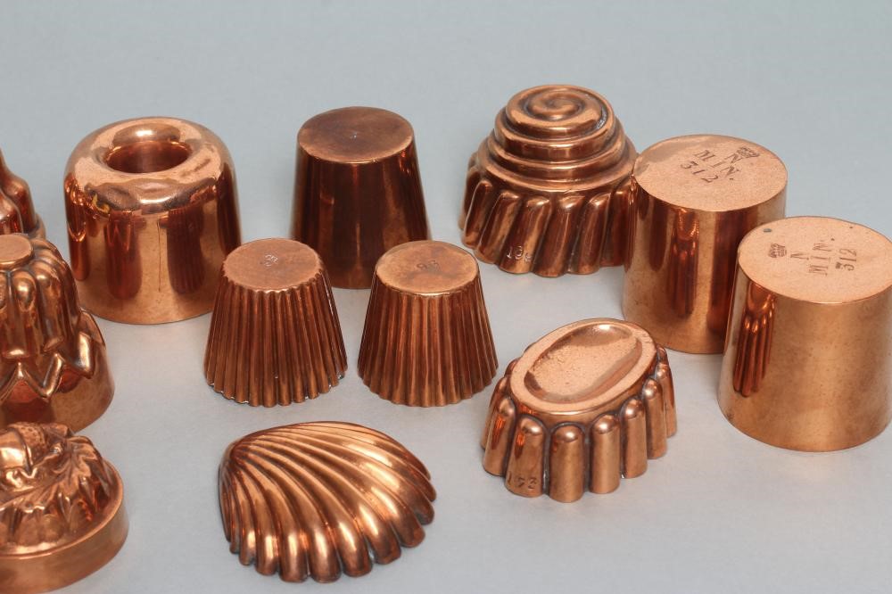 FIFTEEN SMALL VICTORIAN COPPER JELLY MOULDS including a shell Image