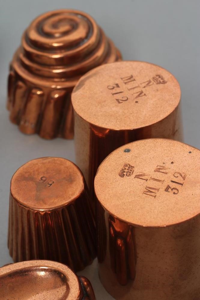 FIFTEEN SMALL VICTORIAN COPPER JELLY MOULDS including a shell Image